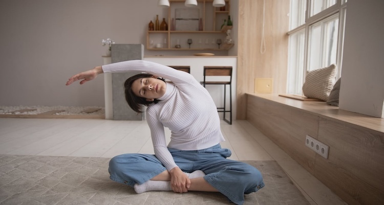 A woman stretching on the floor