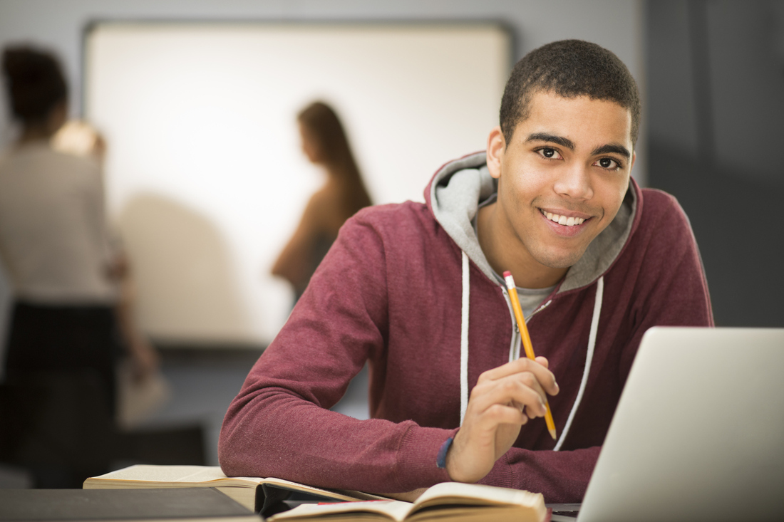 Student Sat Working On A Computer